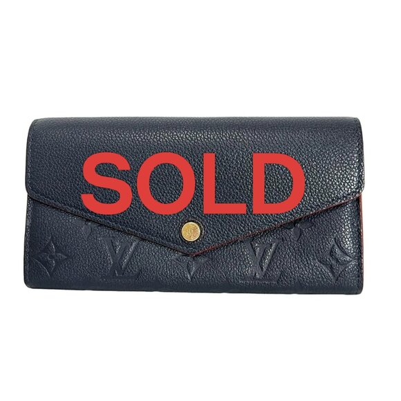 LOUIS VUITTON Portefeuille Sara Marine Rouge Monogram Empreinte - 360-071525 - Picture 1 of 5